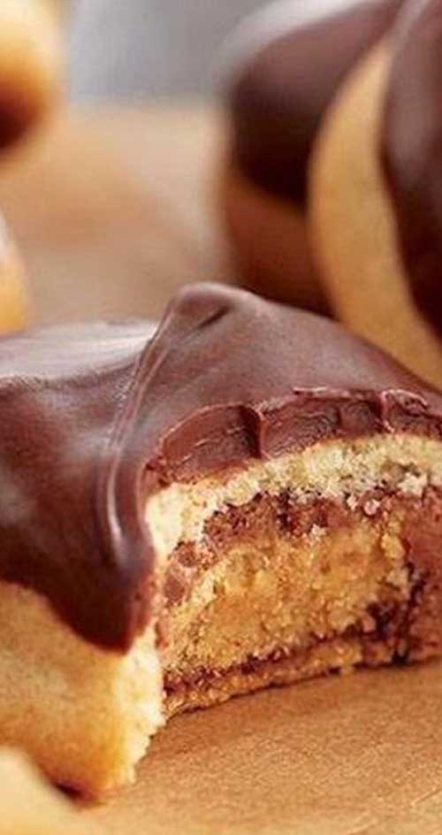 Recipe for Peanut Butter Secrets - A peanut Butter cookie stuffed with a Peanut Butter Cup, and topped with a peanut butter chocolate glaze. I LOVE them!