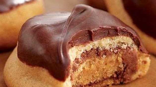 Recipe for Peanut Butter Secrets - A peanut Butter cookie stuffed with a Peanut Butter Cup, and topped with a peanut butter chocolate glaze. I LOVE them!