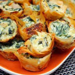 Spanakopita Bites are mini phyllo pastry shells filled with a delicious spinach and feta cheese filling.