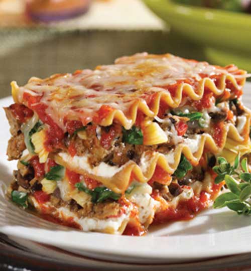 This Lasagna with Spinach is both filling and satisfying. Not only does it have sausage, ground beef and three types of cheese; it also has all those veggies stuffed in. With all of the other goodness, we are sure picky eaters won't mind.