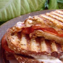 These Caprese Panini Mozzarella Tomatoes and Basil are just some crunchy cheesy goodness in sandwich form!!