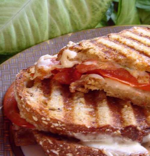 These Caprese Panini Mozzarella Tomatoes and Basil are just some crunchy cheesy goodness in sandwich form!!
