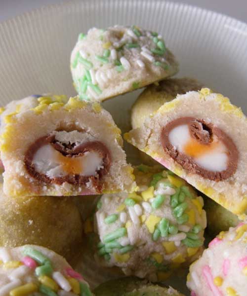 Cadbury Cream Egg Surprise Cookies Recipe - Here is a cookie that screams Easter. Pastel colored cookies, filled with Cadbury cream eggs! It's a treat inside of a treat.