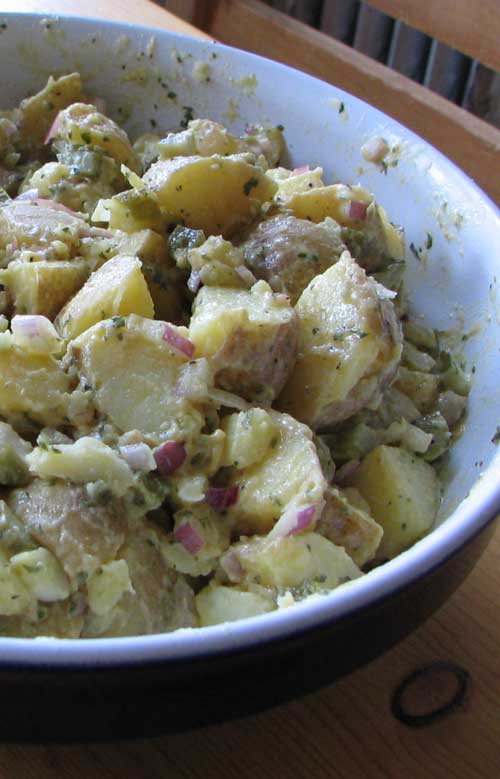 Recipe for Authentic German Potato Salad - Bavarian Kartoffel Salat, from My “Mutti” she was from Bavaria. I’m being sincere, when I say that my Mutti’s potato salad is the best I’ve ever tasted. Her customers, from her delicatessen, would buy it freshly made, and it always sold out by lunch time.