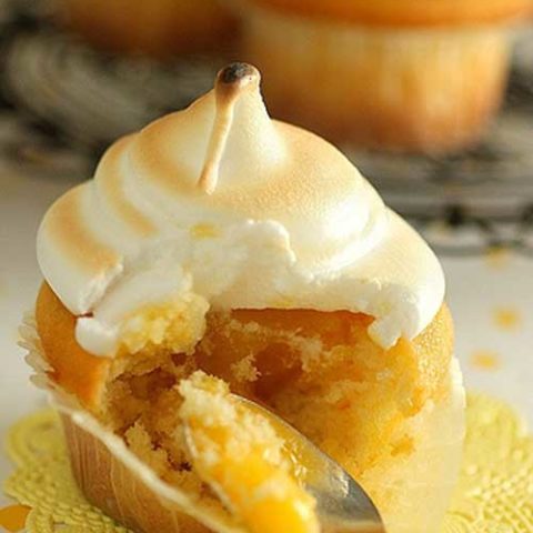 Recipe for Lemon Meringue Cupcakes - The cake is made with pouring cream instead of butter, is a breeze to make and yields a beautiful even dome shaped cupcake.