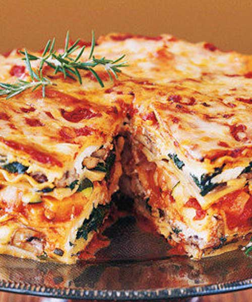 This Mile High Veggie Lasagna Pie is stacked with fresh vegetables, baby greens, aromatic herbs, three kinds of Italian cheeses, and a rich, hearty tomato-basil sauce. It’s ideal for a special-occasion dinner.