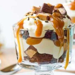 Recipe for Peanut Butter Cup Trifle - Here is a dessert with the visual wow factor, just as much as the incredible taste. What an amazing recipe. We especially love that it is so quick and easy to put together. Plus, chocolate. What else needs to be said?