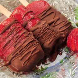 Recipe for Chocolate Dipped Strawberry Popsicles - What is there not to like – luscious sweet strawberries, mashed up, and frozen on a stick. Then dip them chocolate! – Oh my children of all ages (and adults) will love these!