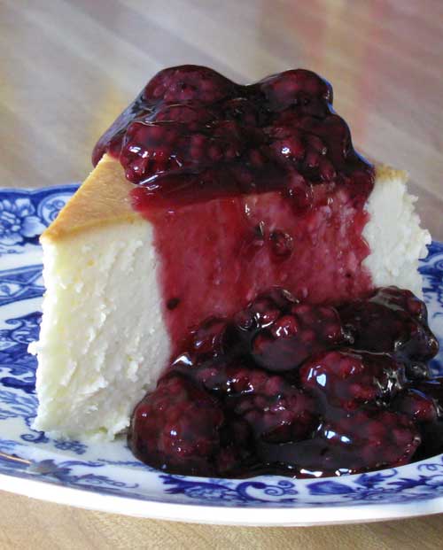Recipe for New York Cheesecake with Blackberry Topping - This is the single best cheesecake I have ever had. I discovered this Jim Fobel’s cookbook about 20 years ago, and it is the one I return to again and again. It is creamy smooth, lightly sweet, with a touch of lemon. This cheesecake has become the favorite of family and friends who’ve had the good fortune to be served this slice of heavenly goodness.