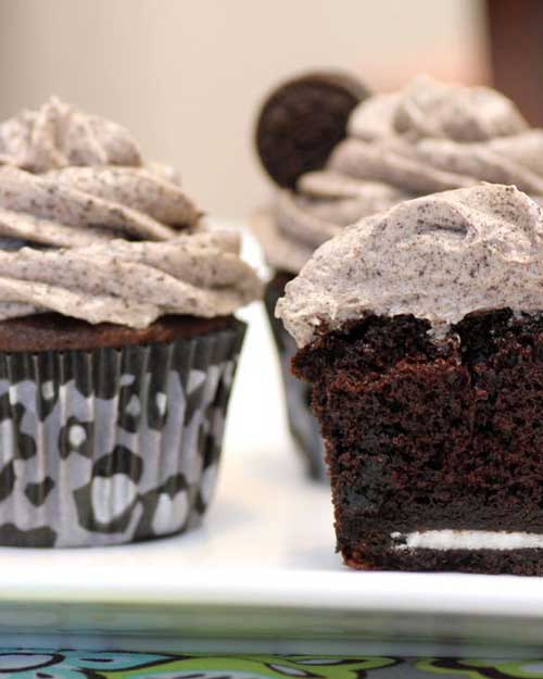 Recipe for Death By Oreo Cupcakes - You put a whole Oreo at the bottom of the cake. The cookie stays firm, which makes it a little interesting to eat against the soft cake, but it actually gave a really yummy crunch. Overall this is an amazing cake.