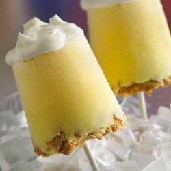 Recipe for Lemon Meringue Pie Pops - What could be better than a slice of pie? Pie pops! Our frozen take on lemon meringue pie has a graham cracker crust, creamy lemon filling and a fluffy topping. Basically it’s your own little piece of heaven–on a stick!