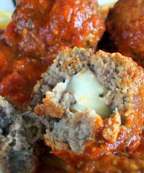 Recipe for Mozzarella Stuffed Meatballs - These meatballs are amazing! I don't make them often enough but am always so glad when I finally do. They are great on top of spaghetti and they also make fantastic meatball hoagies!