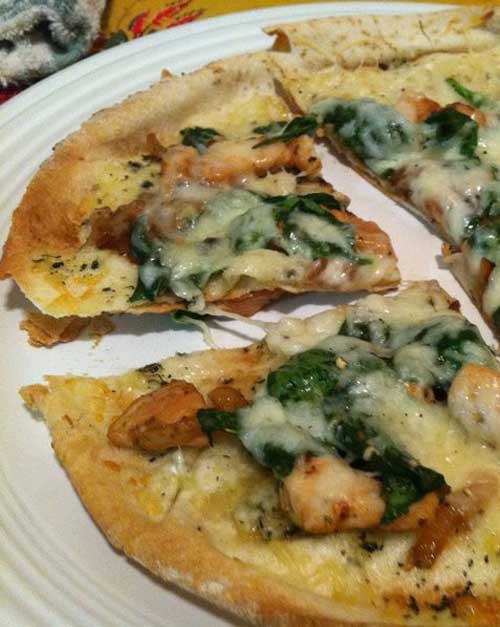 Recipe for Chicken and Spinach Pita Pizzas - Having taken logic I can determine that a Long day equals quick meal. Therefore, pita pizzas equal delicious.