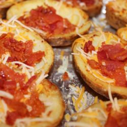Recipe for Restaurant Style Potato Skins - Crispy bacon, ooey, gooey cheese and crispy yet soft potatoes combine to make the most awesome of appetizers!