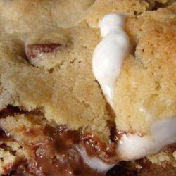 Recipe for Smores Stuffed Chocolate Chip Cookies - Have you ever seen a more delicious-looking cookie?! Me neither. And I’ve seen lots of cookies. These are chocolate chip cookies STUFFED WITH S'MORES. It's a cookie within a cookie! I don't understand why no one thought of this sooner.
