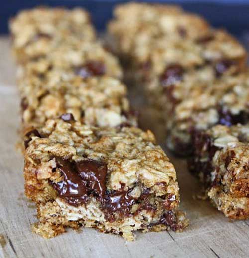 Recipe for Banana Oatmeal Breakfast Bars - Soft and chewy oatmeal bars with a great hit of banana flavor, speckled with chocolate chips, baked and served warm. Don’t let the oatmeal fool you, these are breakfast, lunch, dinner and dessert, if you ask me!