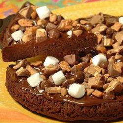 Recipe for Peanut Buster Pizza - When I made it for the first time, it surprised my husband and kids and particularly my mother as they never expected a “sweet pizza”. Now it’s a staple for my family whenever they want to have a unique and unusual dessert.