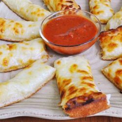 Recipe for Cheesy Bread Sticks - Ahhh, cheesy bread sticks.....let me just say, KIDS LOVE THESE THINGS! OK, who am I kidding, it's not just kids who love these....grown ups do too!