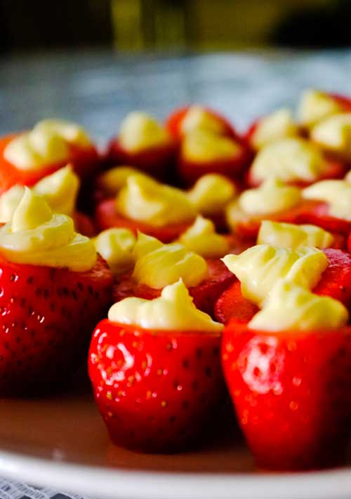 Recipe for Cheesecake Stuffed Strawberries - You’ll love these guilt-free little cheesecake stuffed strawberries. So easy and perfect for spring or summer parties!