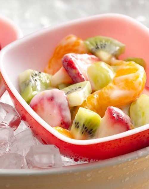 A creamy yogurt dressing—flavored with orange juice and grated peel—beautifully coats fresh fruits.