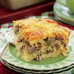Recipe for Company Breakfast Casserole - For a southwest flair, replace the mushrooms with a small can of sliced olives, add Monterey Jack cheese instead of Cheddar and serve with spicy salsa on the side.