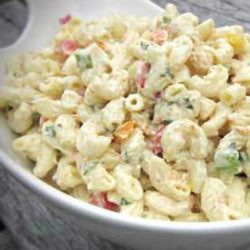 Recipe for Party Macaroni Salad - This recipe makes a great side dish for any summer barbecue or picnic. Make it in advance and refrigerate it for at least two hours.