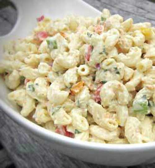 Recipe for Party Macaroni Salad - This recipe makes a great side dish for any summer barbecue or picnic. Make it in advance and refrigerate it for at least two hours.