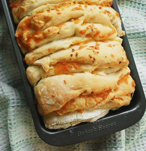 Recipe for Cheesy Herb Pull-Apart Bread - While it was baking, the loaf smelled like pizza baking up in the oven. Maybe I should whip up some marinara next time I make this?