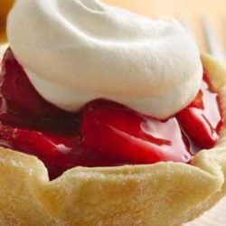 Recipe for Fresh Strawberry Tarts - It’s easier than you think: The tart shells are made with an inverted muffin pan. Pie crust rounds are draped over the inverted cups and baked. Then, just fill and enjoy!