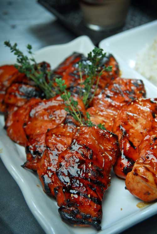 Recipe for Asian Barbeque Chicken - You are sure to surrender to the sweet aroma of this chicken being cooked in an open fire.