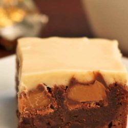 Recipe for Double Caramel Brownies - These start with a simple, one bowl brownie recipe…then after they are baked, chocolate covered caramels are pressed into the hot brownies. Cream cheese icing infused with caramel completes this dessert.