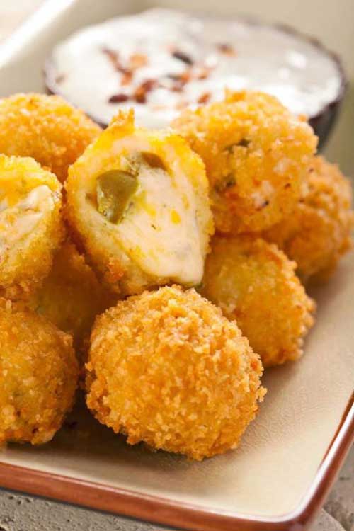 These Jalapeno Cheese Fritters are the ultimate appetizer. Gooey cheese and jalapenos in a crunchy shell. What more could you want? - A copycat recipe from Abuelo’s Mexican Food Embasy.. YUM!!