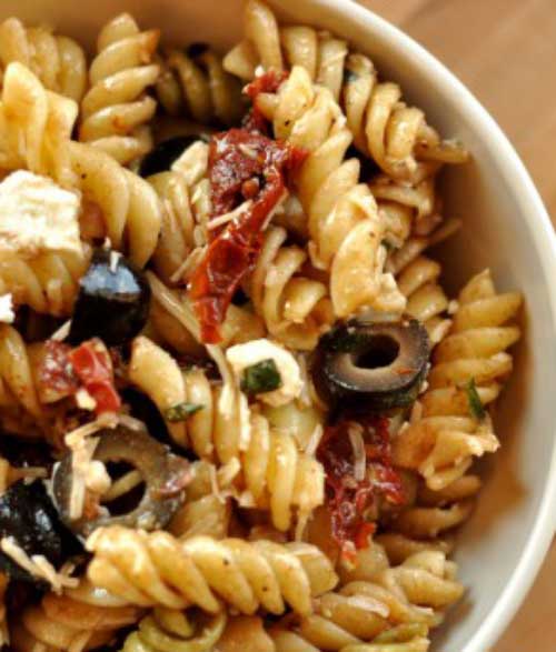 Recipe for Mediterranean Pasta Salad - This colorful pasta salad recipe comes together in minutes and is sure to steal the show at any picnic or dinner table.
