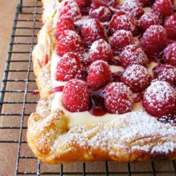 The combination of flaky crust, creamy filling, and fresh fruit makes this Rustic Raspberry Lemon Cheesecake Tart irresistible in my book.