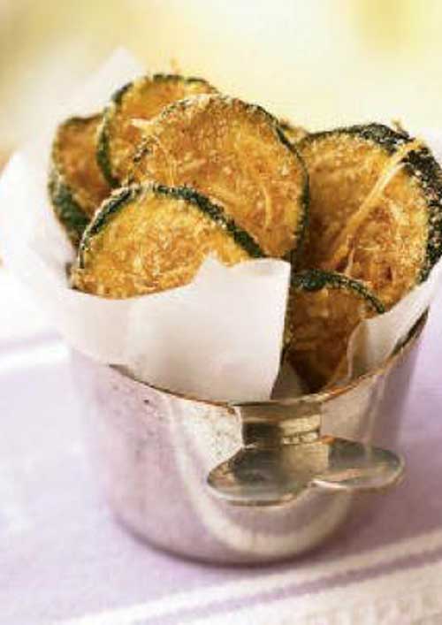 Breaded, oven-fried zucchini chips taste like they’re fried, yet they are baked and amazingly crispy. These chips make a healthy substitute for French fries or potato chips.