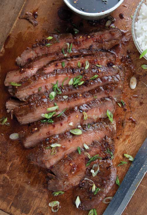 Recipe for Soy-Ginger Flank Steak - This steak packs so much flavor, and is sooo juicy. Serve with generous scoops of rice and roasted asparagus or broccoli or a big green salad.
