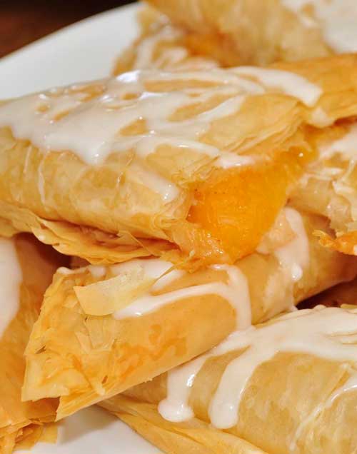 Recipe for Peach Turnovers - Once you make these and see just how easy they are to put together, they will become your go-to breakfast-to-impress. They can also double as dessert.