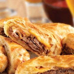 Recipe for Philly Cheesesteak Rolls - These upscale cheesesteak sandwiches feature flaky puff pastry instead of ordinary rolls. They're easy to make, and even easier to enjoy!