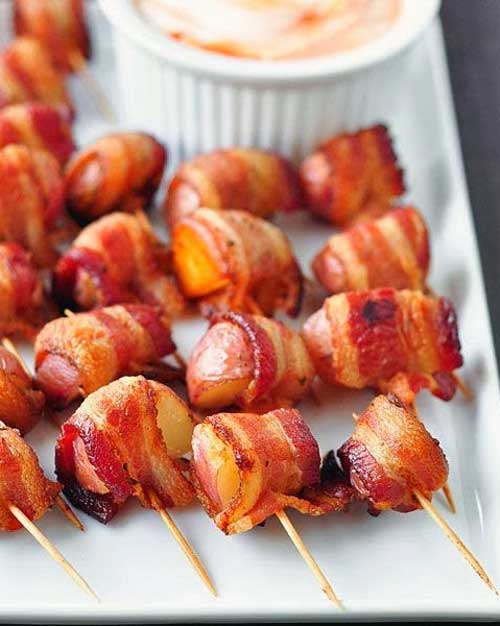 Recipe for Bacon-Wrapped Potato Bites with Spicy Sour Cream Dipping Sauce - I know the basic rules that make perfect appetizers #1 they call for BACON, because you can’t go wrong with anything wrapped in bacon #2 dip them in sour cream. That would make these perfect!