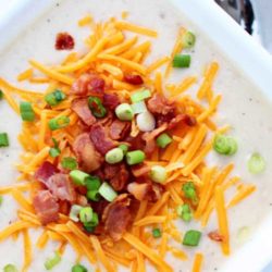 Recipe for Crockpot Creamy Potato Soup - It took me less than 10 minutes to throw this together, and it is the best Potato soup I’ve ever made.