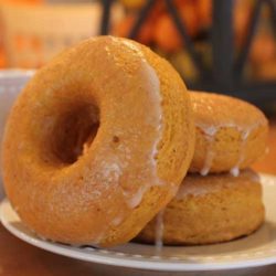 Recipe for Baked Pumpkin Donuts - I made these for a fun breakfast and they turned out great! Topped with a cinnamon glaze and dunked in a little hot cocoa.... perfect for a cold fall morning! Enjoy!