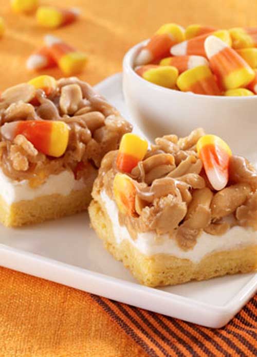 Recipe for Scarecrow Treats - These Halloween desserts, topped with candy corn, are chewy and delicious.