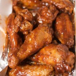 Recipe for Lightened-up Sweet and Spicy Chicken Wings - Wings are easy to make at home, and baking them in the oven cuts down on the fat and grease. Impress your friends with our sweet and spicy homemade version.