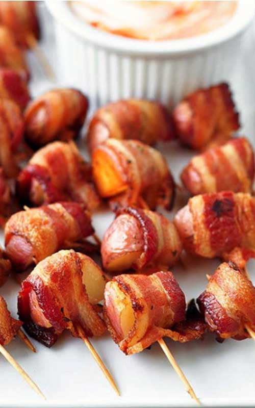 Recipe for Bacon Wrapped Rosemary Potatoes - The perfect party food...potatoes and bacon! This is my goto recipe for any party, and they ALWAYS disappear!