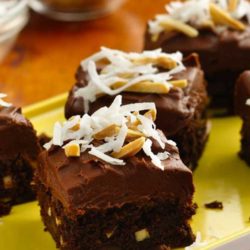 Recipe for Chocolate Chunk Almond Brownies - These indulgent buttery rich brownies accented with coconut and almonds, perfect for the holidays!