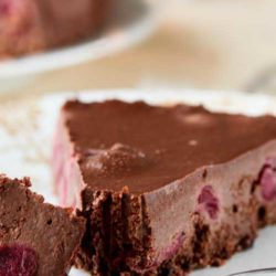 Recipe for Black Forest Chocolate Cheesecake - This cheesecake drew quite a knockout reaction when I made it, and I’m sure you can see why. It is bursting with sweet cherries layered between a chocolate crust and a creamy chocolate cheesecake filling.