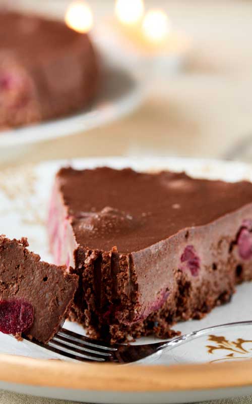 Recipe for Black Forest Chocolate Cheesecake - This cheesecake drew quite a knockout reaction when I made it, and I’m sure you can see why. It is bursting with sweet cherries layered between a chocolate crust and a creamy chocolate cheesecake filling.