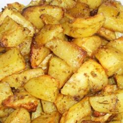 Recipe for Oven Roasted Garlic Potatoes - These roasted potatoes have become a family favorite. The potatoes roast slowly in a bath of lemon and olive oil, soaking up all the garlic-y goodness!