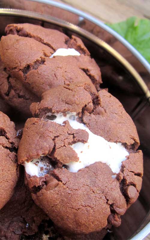 Recipe for Marshmallow Cloud Cookies - These cookies are rich and decadent and the marshmallow centers are gooey and delicious. They’re super fun to make especially if you have kids that like to help!