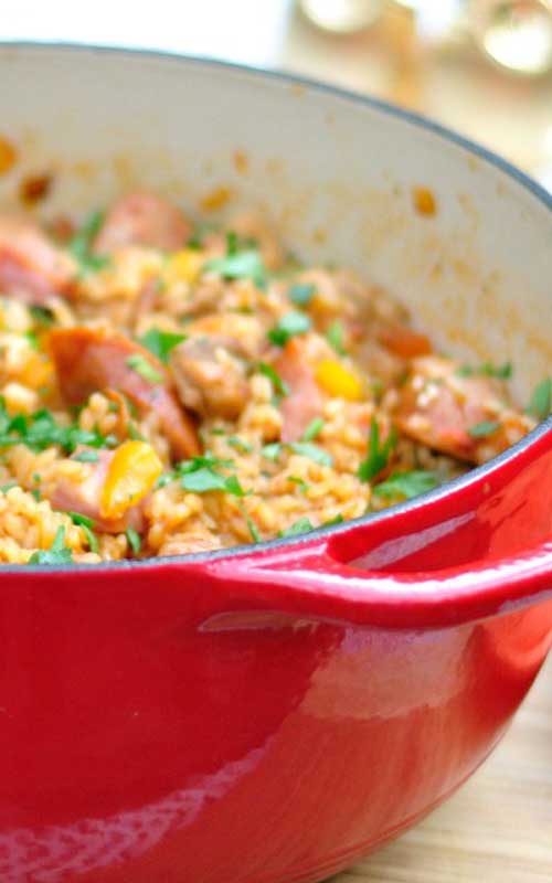 Recipe for Jambalaya with Chicken, Sausage, and Ham - This spicy dish will probably go over like gangbusters, but without leaving you with too many dishes to wash.